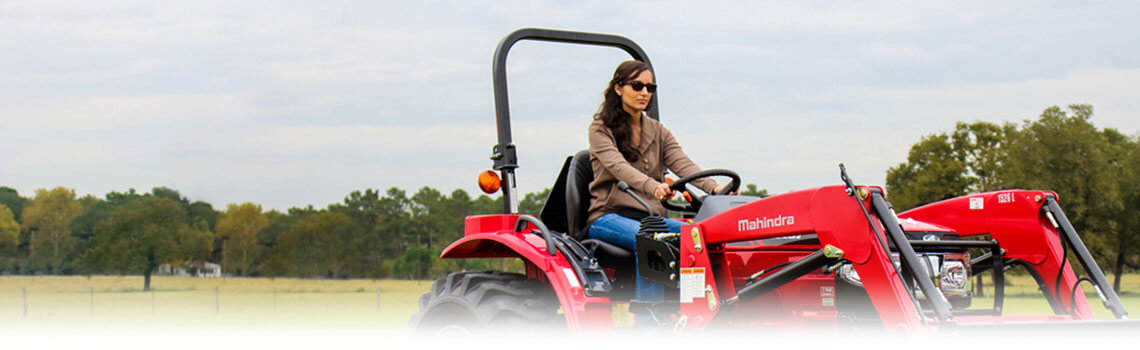 Women on Mahindra Loader